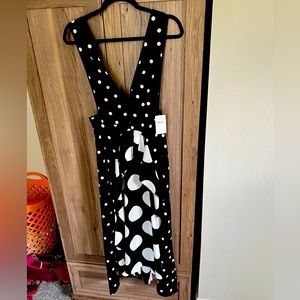 White/Black polka dot low cut dress. Brand new and fits like a glove!